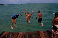 Island boys jumping off dock - Pohnpei, Micronesia