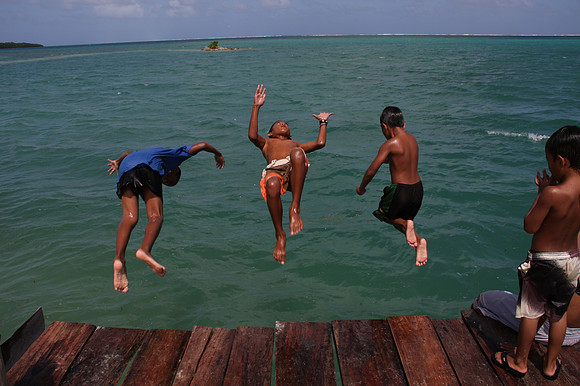 Island boys jumping off dock - Pohnpei, Micronesia