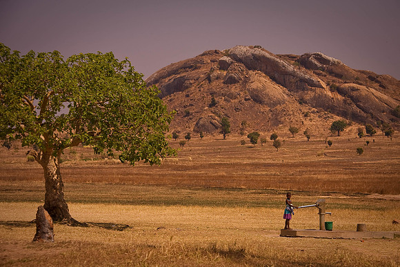 Girl pumping water - Malawi
