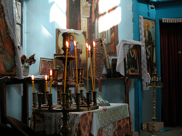 Icons and candles in church in Apriltsi, Bulgaria