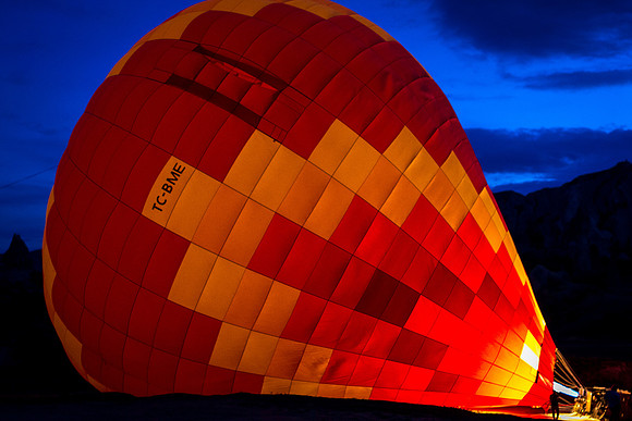 Hot air balloon being filled at sunrise